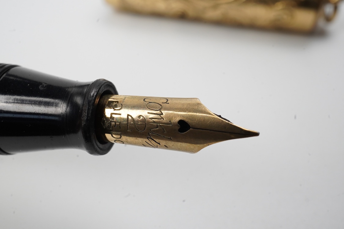 A Conklin ring top hand engraved crescent filler fountain pen with 14ct. gold Conklin nib